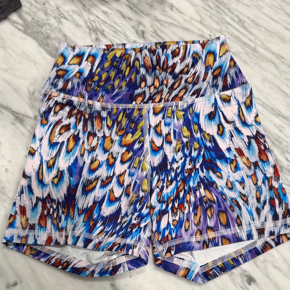Fleo Multicolor Feather-Print Athletic Shorts in Blue, Purple, Yellow